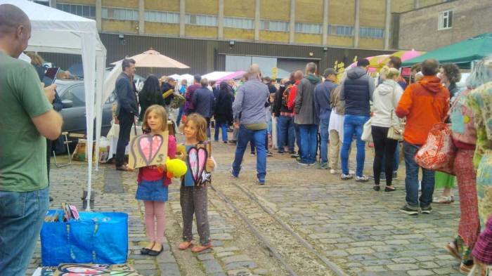 two parts of the 2015 One Hundred Pieced Pieces with their buyers